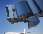 NBCU Programming Widens Airport Terminal Reach Bridge and airplane at airport, Melbourne Australia