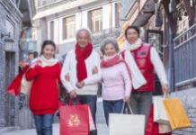 How Humans Decide What To Consume Family shopping together dressed in holiday attire
