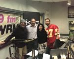 Alpha Media’s $267 Million Wound: Is West Palm Beach To Blame? RBR+TVBR Editor-in-Chief Adam R Jacobson (second from left) poses with members of the KVJ Show at WRMF-FM in West Palm Beach in this January 2020 file photo.