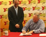 Guy Phillips re-ups with Y98