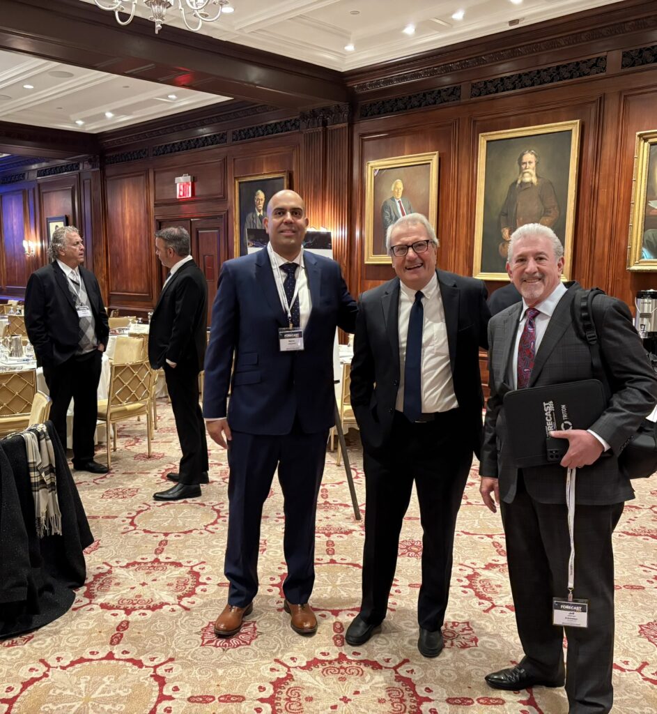 Marino Then, National Integrated Marketing Solutions Manager at Entravision Communications (at left), poses with Fletcher Heald & Hildreth partner Francisco Montero and Entravision President/Chier Operating Officer Jeffery Liberman ahead of Forecast 2026's opening sessions.