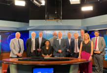 A Trusty Trip Yields Gray Media Station, Bonneville HQ Visits FCC Commissioner Olivia Trusty is seated at the anchor desk of Gray Media-owned WIBW-TV in Topeka, Ks.